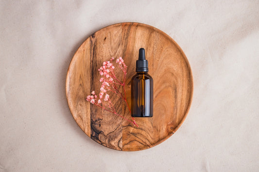a bottle of perfume on a wooden table